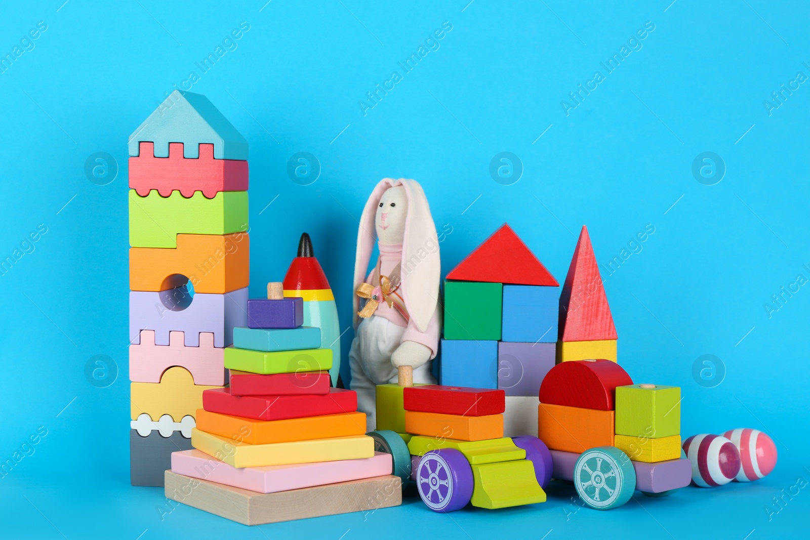 Photo of Set of different toys on blue background