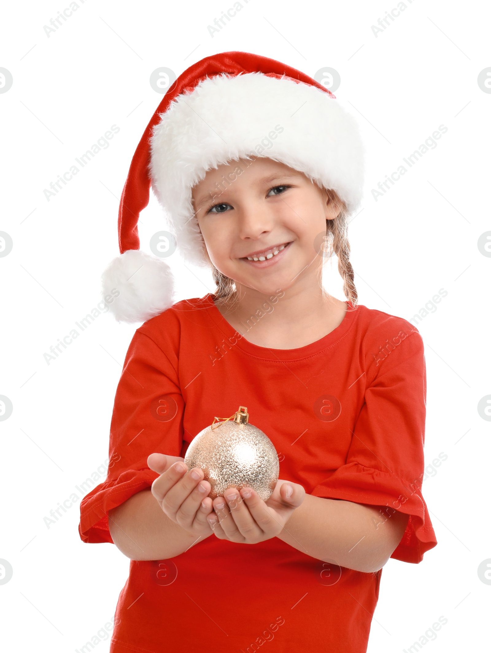 Photo of Cute little child wearing Santa hat with Christmas decoration on white background