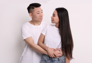 Portrait of happy couple on white background