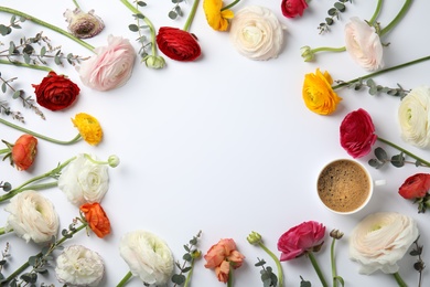 Flat lay composition with spring ranunculus flowers and cup of coffee on white background. Space for text