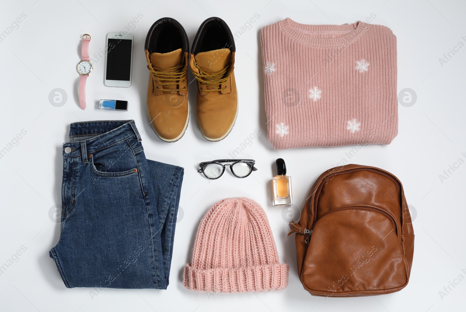 Photo of Flat lay composition with female winter clothes on white background