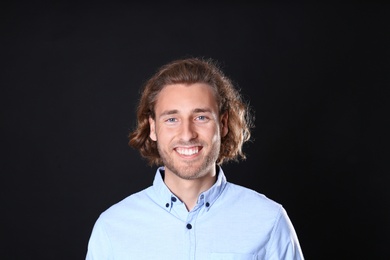 Photo of Portrait of handsome man on black background