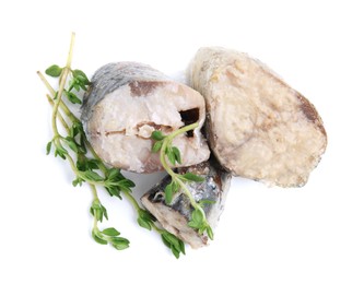 Photo of Canned mackerel chunks with thyme on white background, top view