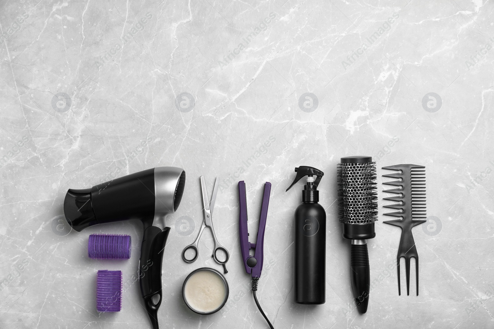 Photo of Professional hairdresser set on light background