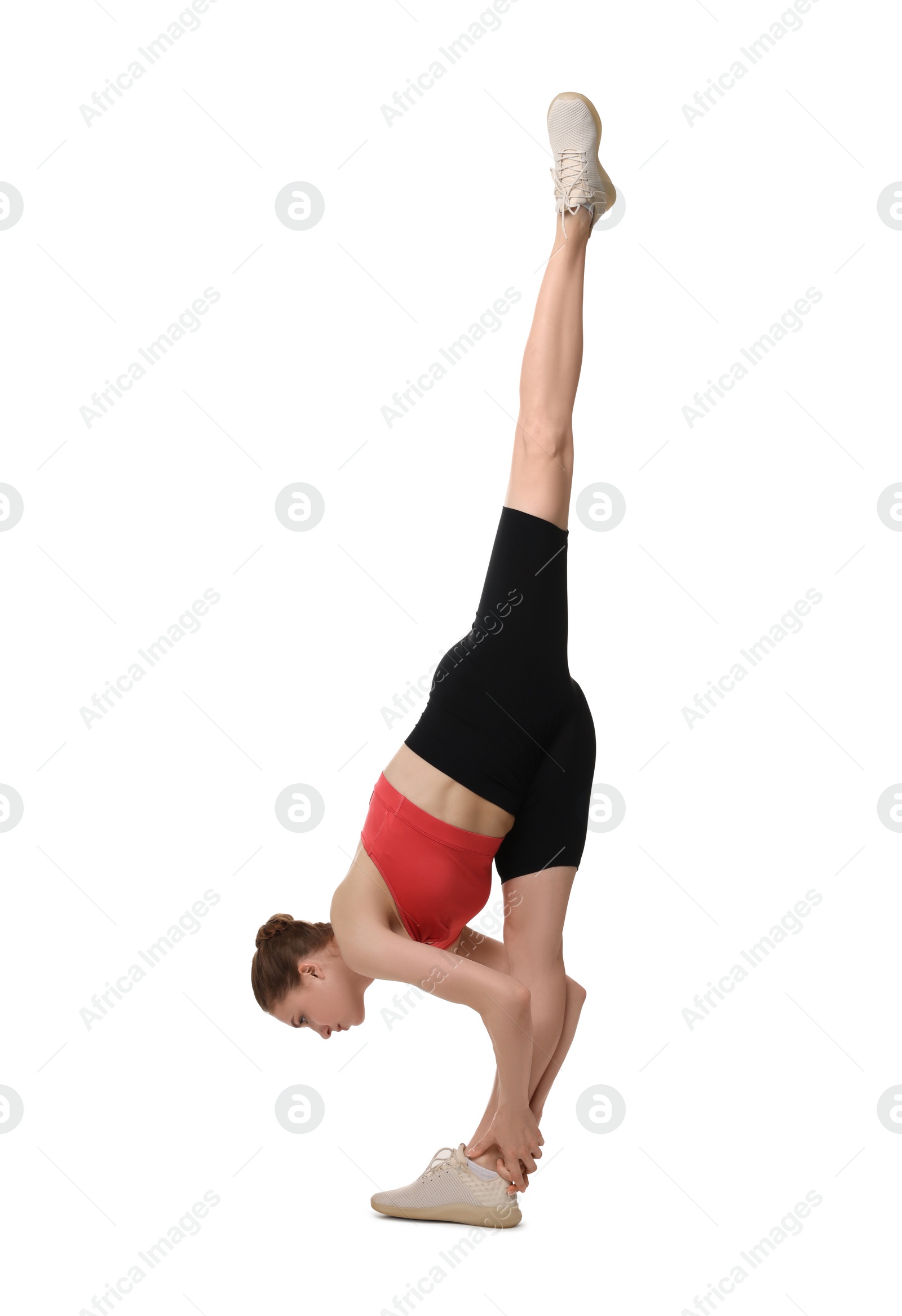 Photo of Yoga workout. Young woman stretching on white background