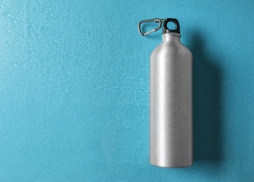 Photo of Sports water bottle on color background. Space for text