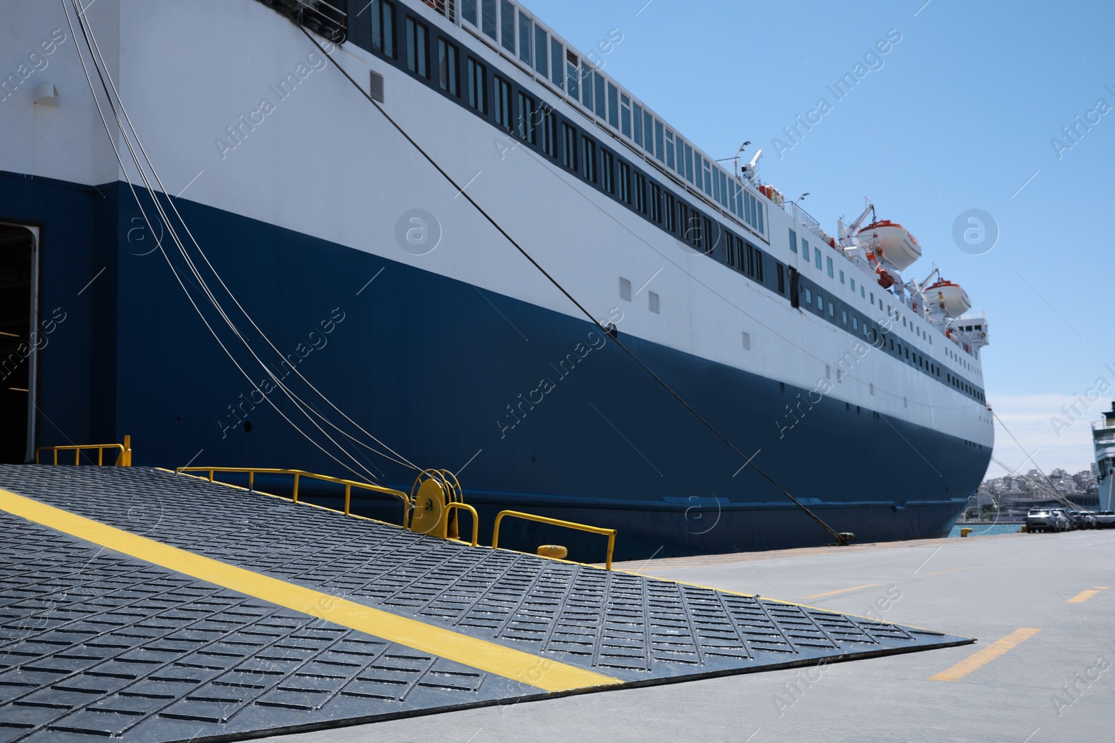 Photo of Modern ferry in sea port on sunny day