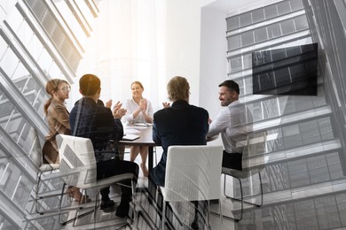 Image of Partnership, cooperation, collaboration. Double exposure of buildings and people in meeting room