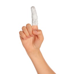 Photo of Woman with finger wrapped in medical bandage on white background, closeup