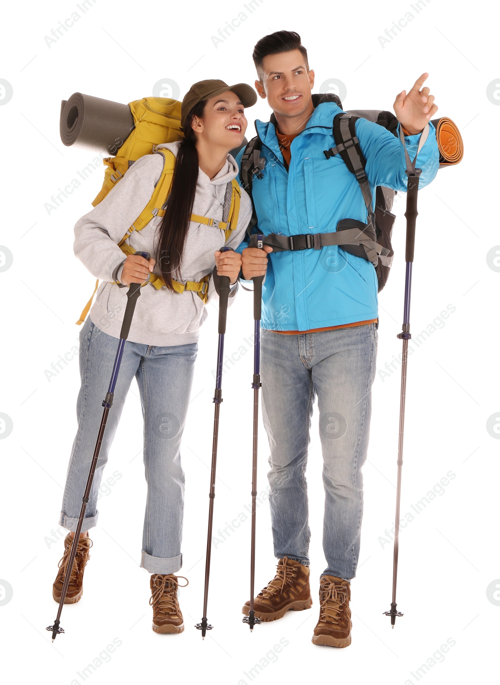 Photo of Couple of hikers with backpacks and trekking poles on white background