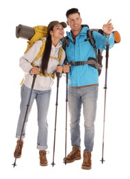 Couple of hikers with backpacks and trekking poles on white background