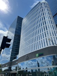 Photo of Warsaw, Poland - July 18, 2022: Beautiful view of Crowne Plaza against blue sky
