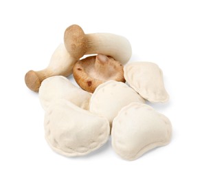 Raw dumplings (varenyky) and fresh mushrooms isolated on white