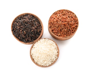 Bowls with different types of rice on white background, top view