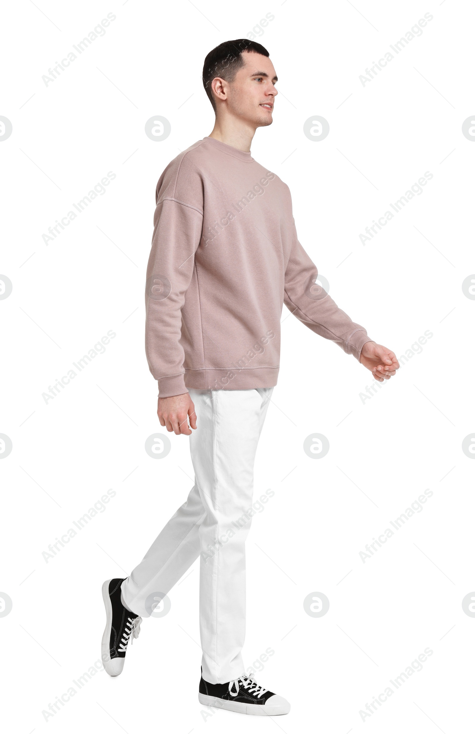 Photo of Full length portrait of handsome young man on white background