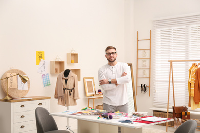 Photo of Fashion designer creating new clothes in studio