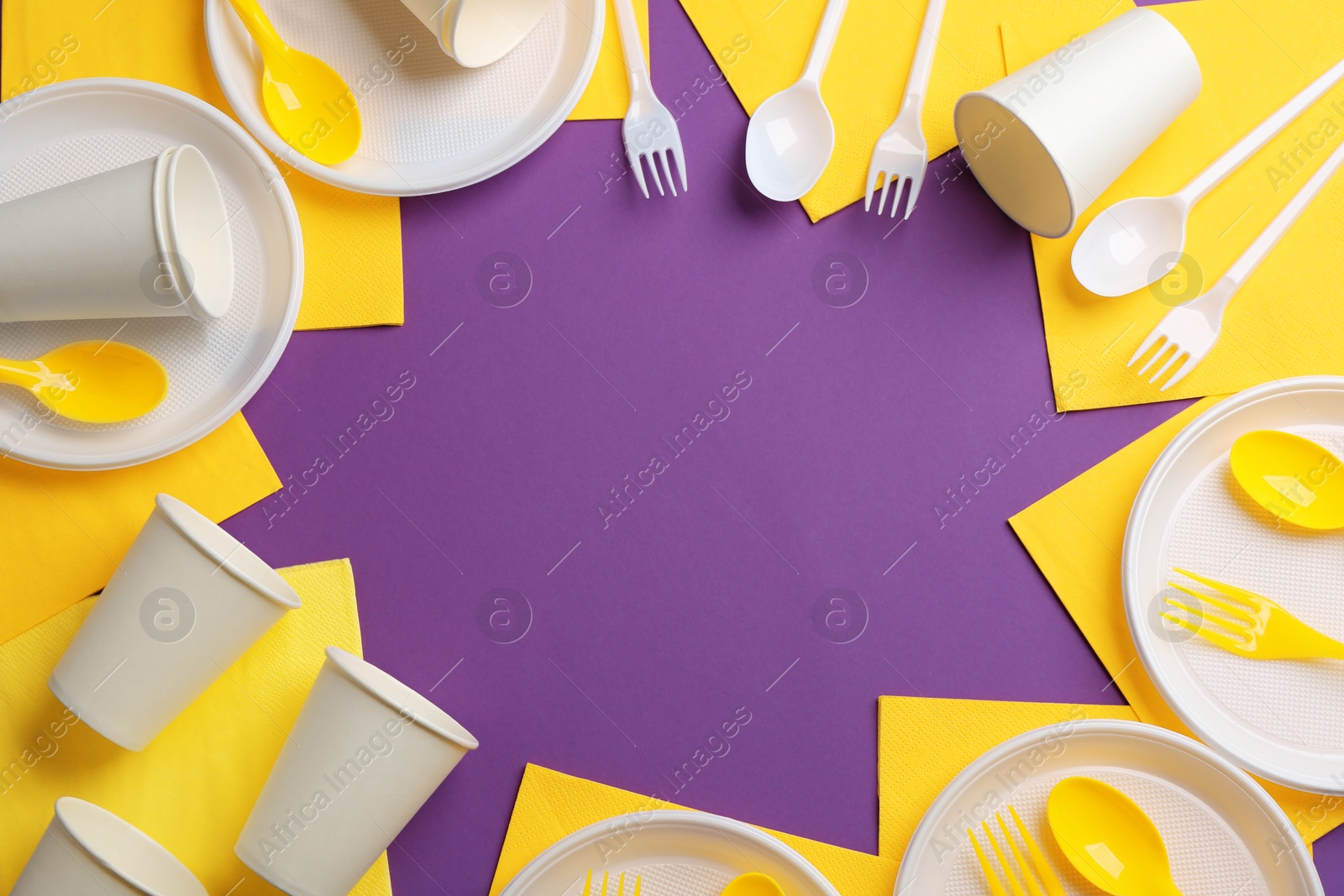 Photo of New plastic dishware and space for text on color background. Table setting