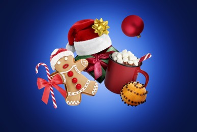 Image of Christmas celebration. Different festive stuff in air on blue gradient background