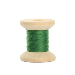 Photo of Wooden spool of green sewing thread isolated on white