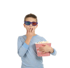 Emotional boy with 3D glasses and popcorn during cinema show on white background