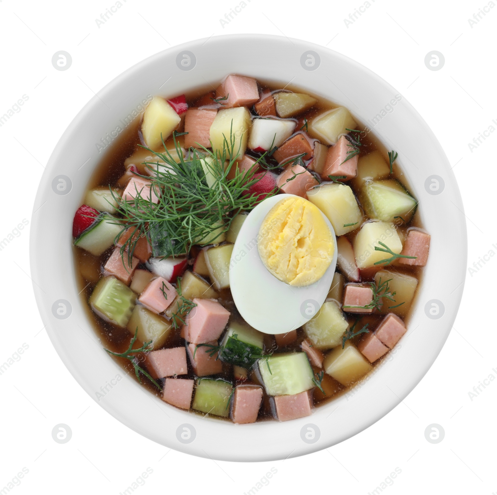 Photo of Delicious cold okroshka with kvass isolated on white, top view. Traditional Russian summer soup