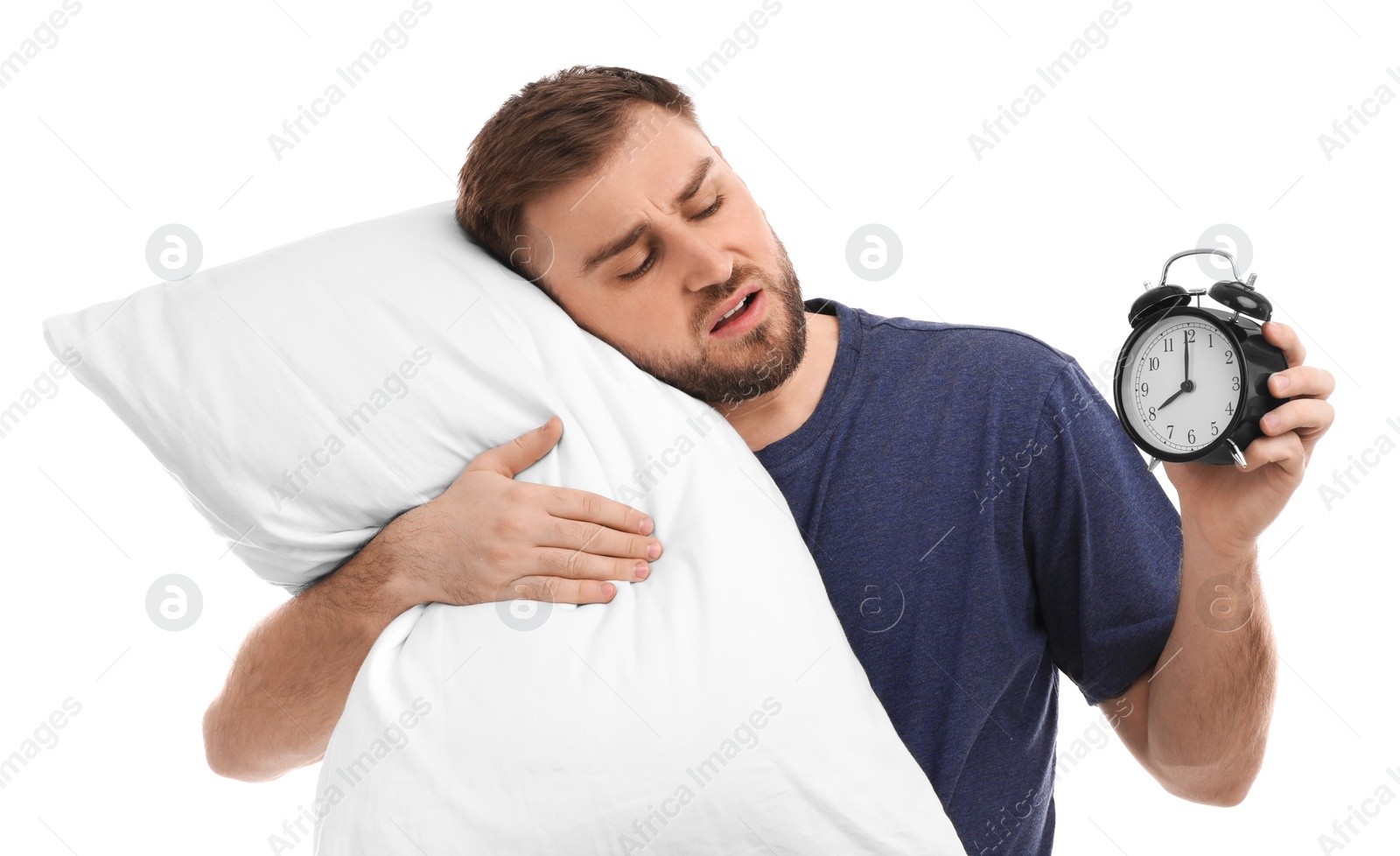 Photo of Sleeping man with alarm clock and pillow on white background. Being late concept