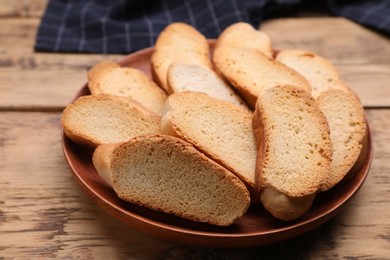 Photo of Plate of hard chuck crackers on wooden table