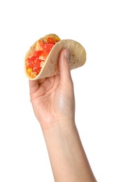 Photo of Woman holding delicious taco with vegetables on white background, closeup