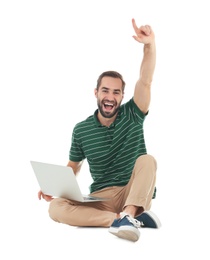 Photo of Emotional young man with laptop celebrating victory on white background