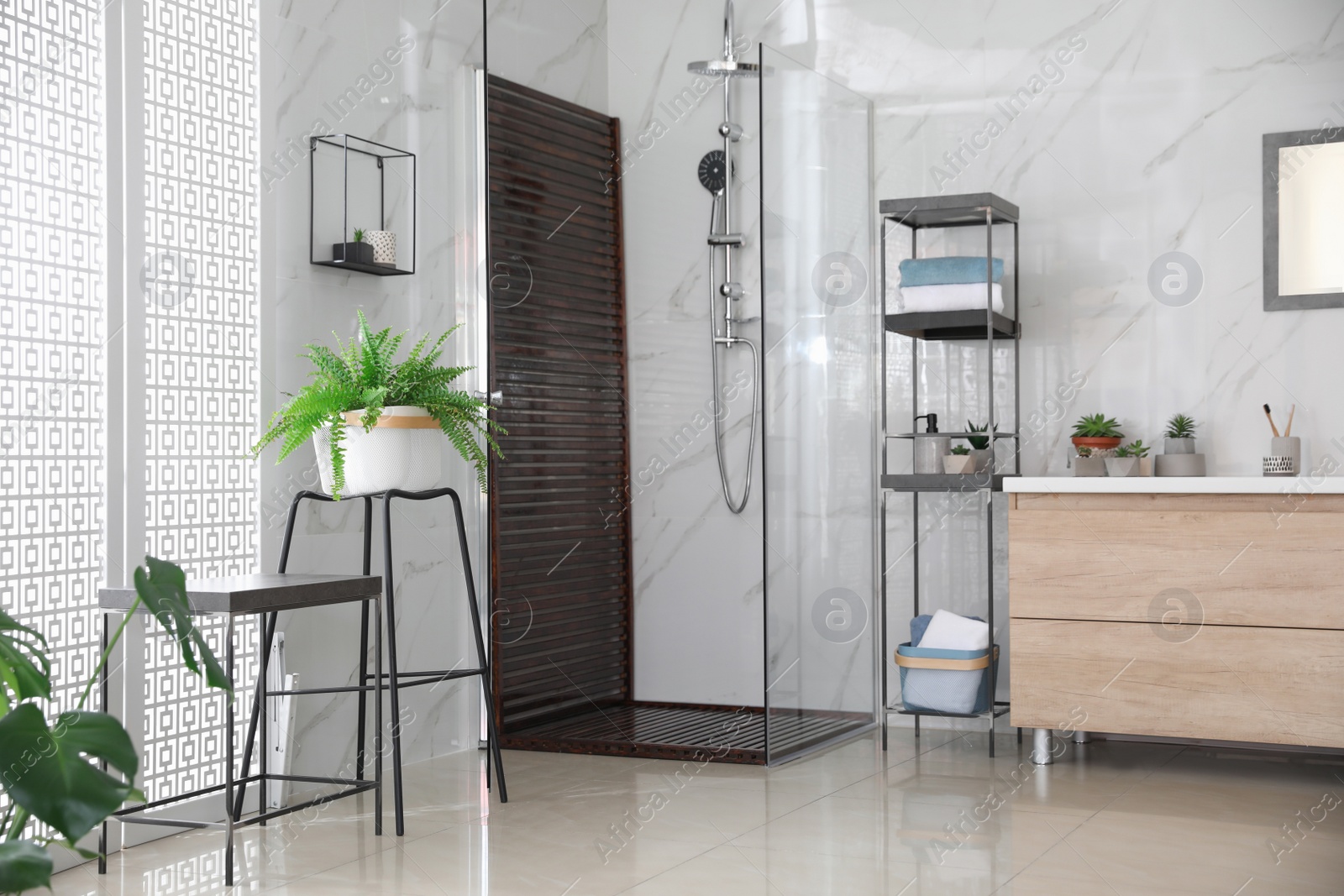 Photo of Bathroom interior with shower stall and counter. Idea for design