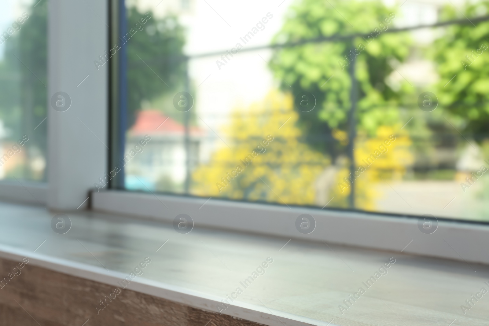 Photo of Closeup view of window with wooden sill