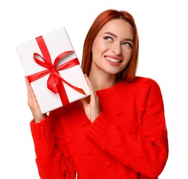 Photo of Young woman in red sweater with gift box on white background. Christmas celebration