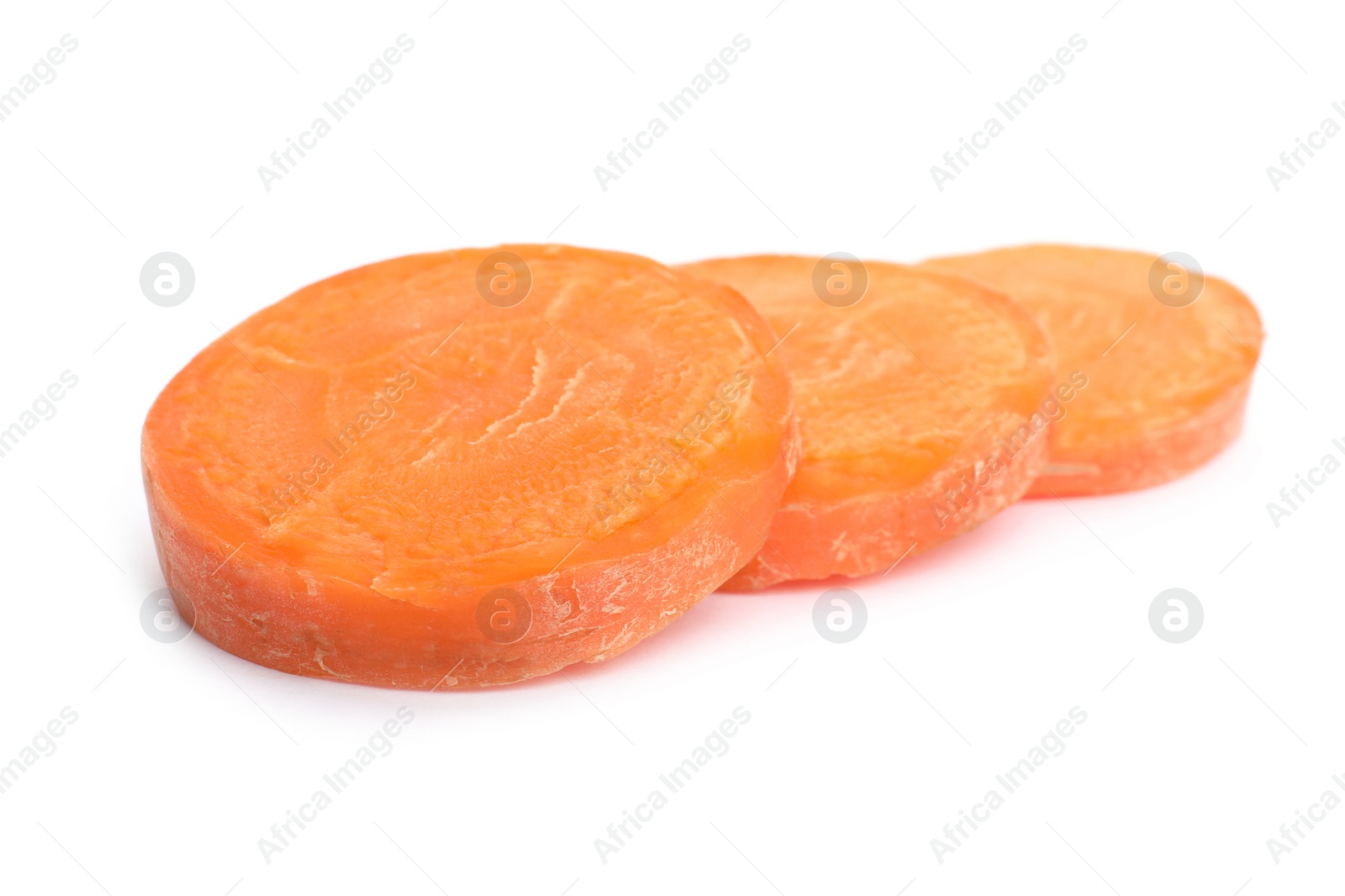 Photo of Slices of fresh ripe carrot on white background