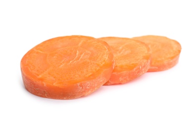 Photo of Slices of fresh ripe carrot on white background