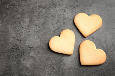 Photo of Homemade heart shaped cookies and space for text on table, top view