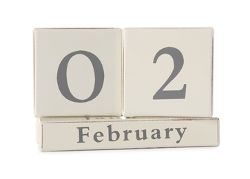 Photo of Wooden block calendar with date February 2nd on white background. Groundhog day