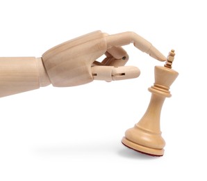 Robot touching chess piece isolated on white. Wooden hand representing artificial intelligence