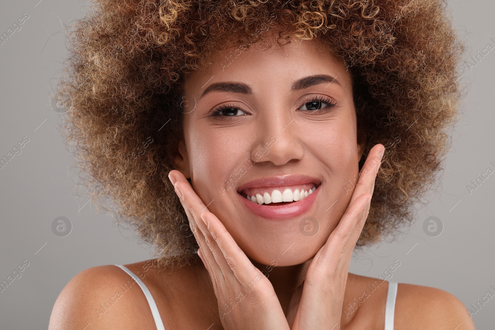 Photo of Beautiful woman with healthy skin on gray background