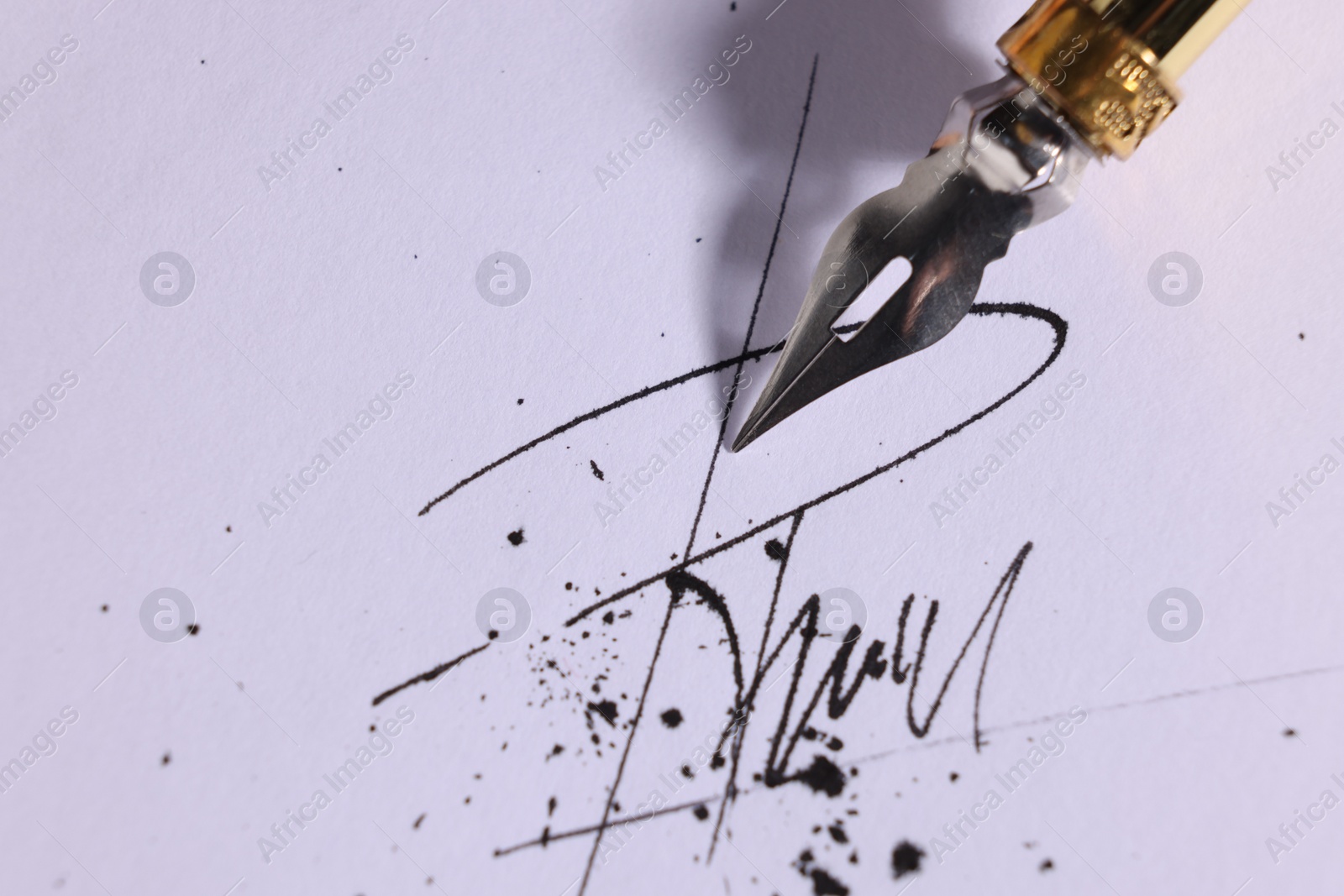 Photo of Signing on sheet of paper with fountain pen, closeup