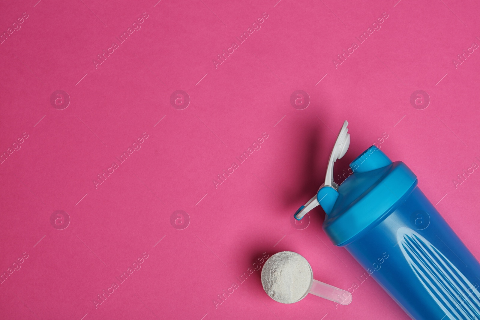 Photo of Bottle, protein powder and space for text on color background, top view. Preparing shake