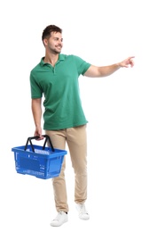 Young man with empty shopping basket isolated on white