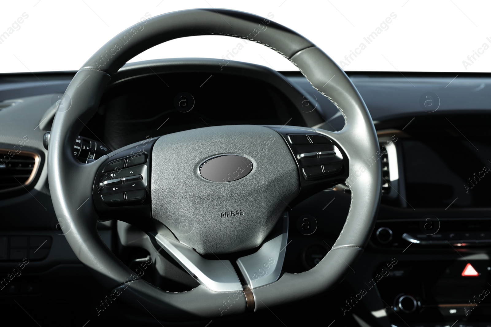 Image of Steering wheel and dashboard in modern car isolated on white