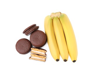 Photo of Tasty banana choco pies and fresh fruits isolated on white, top view