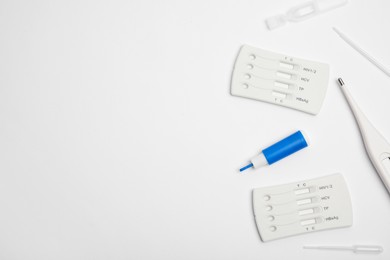 Photo of Disposable express hepatitis test kit on white background, flat lay. Space for text