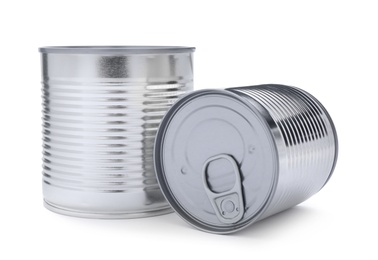 Photo of Closed tin cans of food on white background