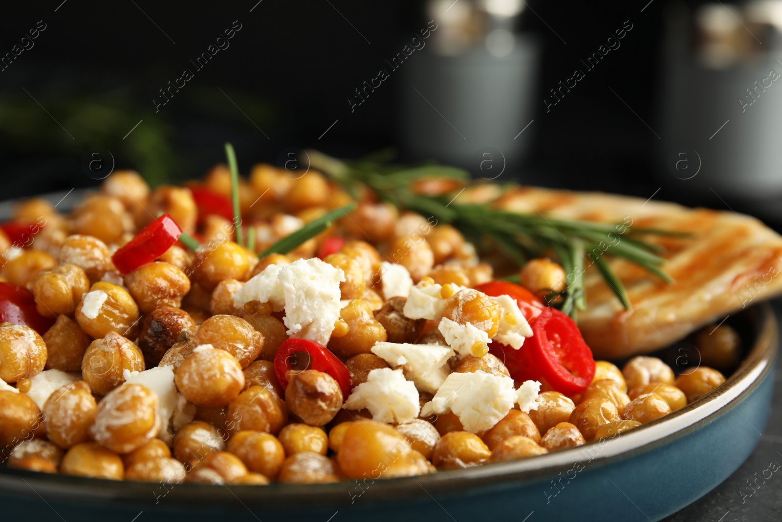 Photo of Delicious fresh chickpea salad on table, closeup