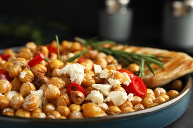 Photo of Delicious fresh chickpea salad on table, closeup