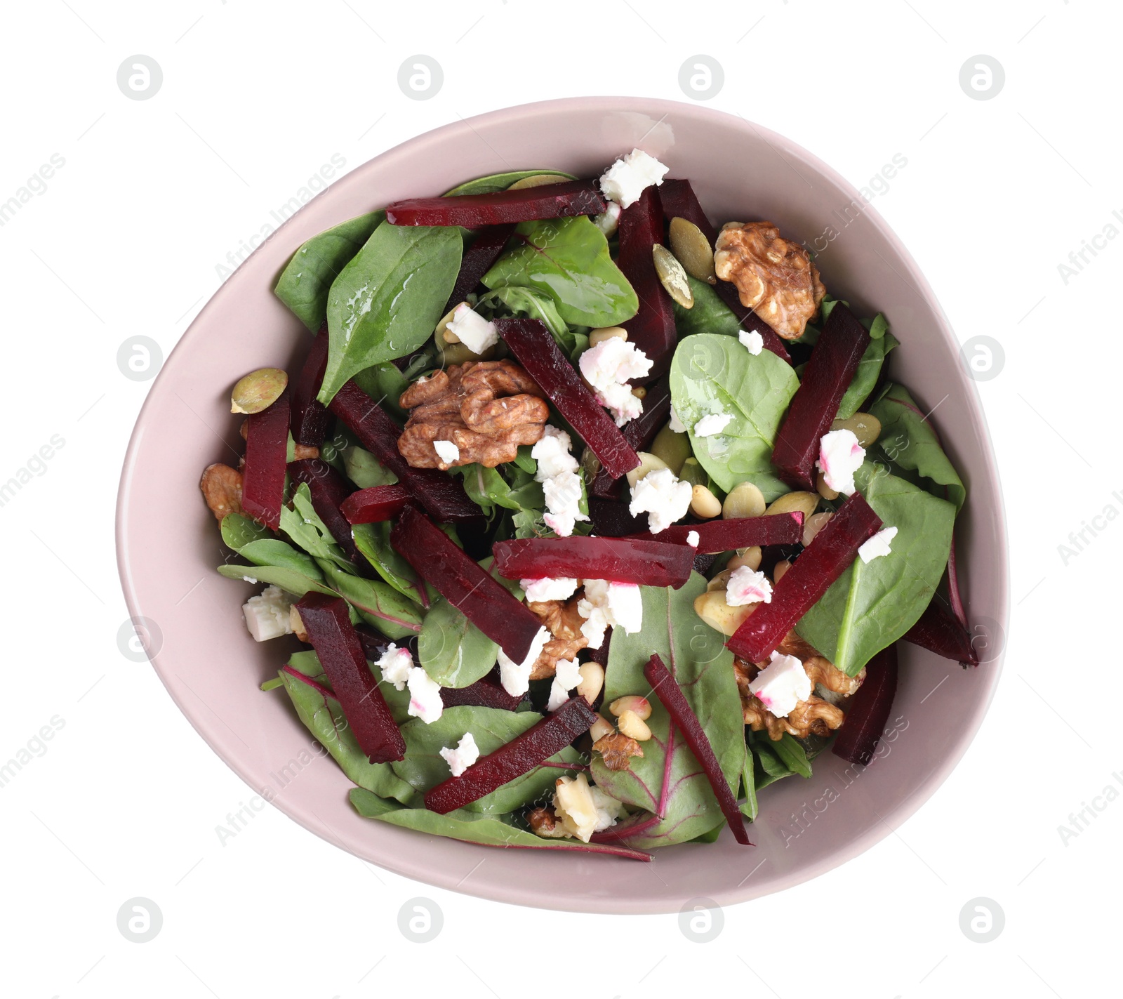 Photo of Delicious beet salad with feta cheese and walnuts in bowl isolated on white, top view