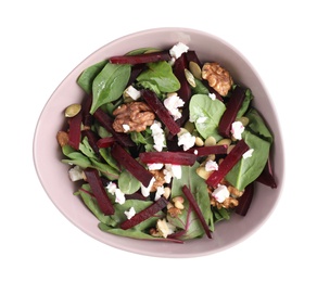 Delicious beet salad with feta cheese and walnuts in bowl isolated on white, top view