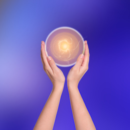 Image of Woman holding concentrated healing energy in her hands, closeup